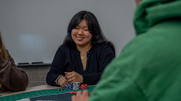 student playing poker in classroom